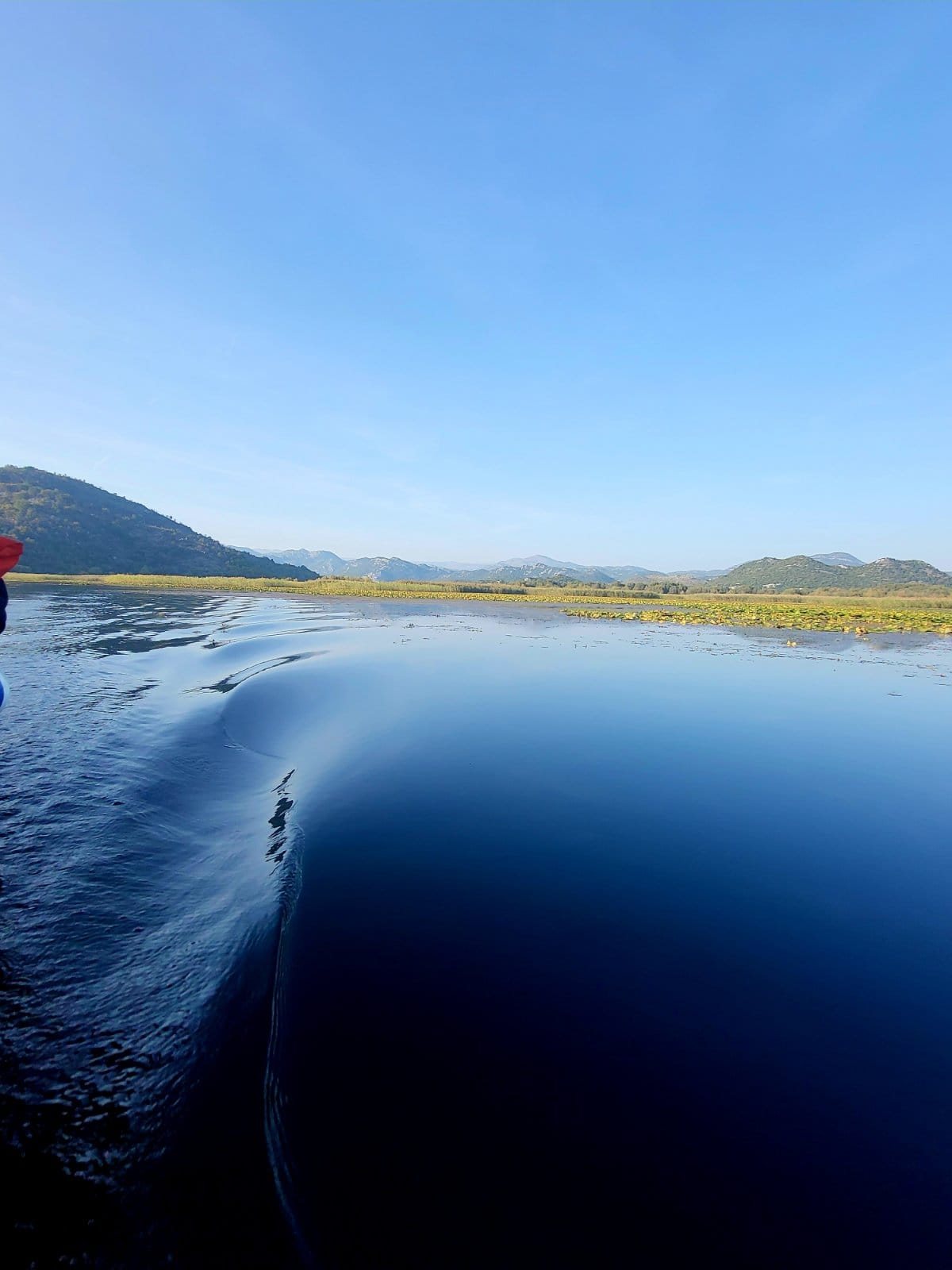 Boat wake across Lake Skadar